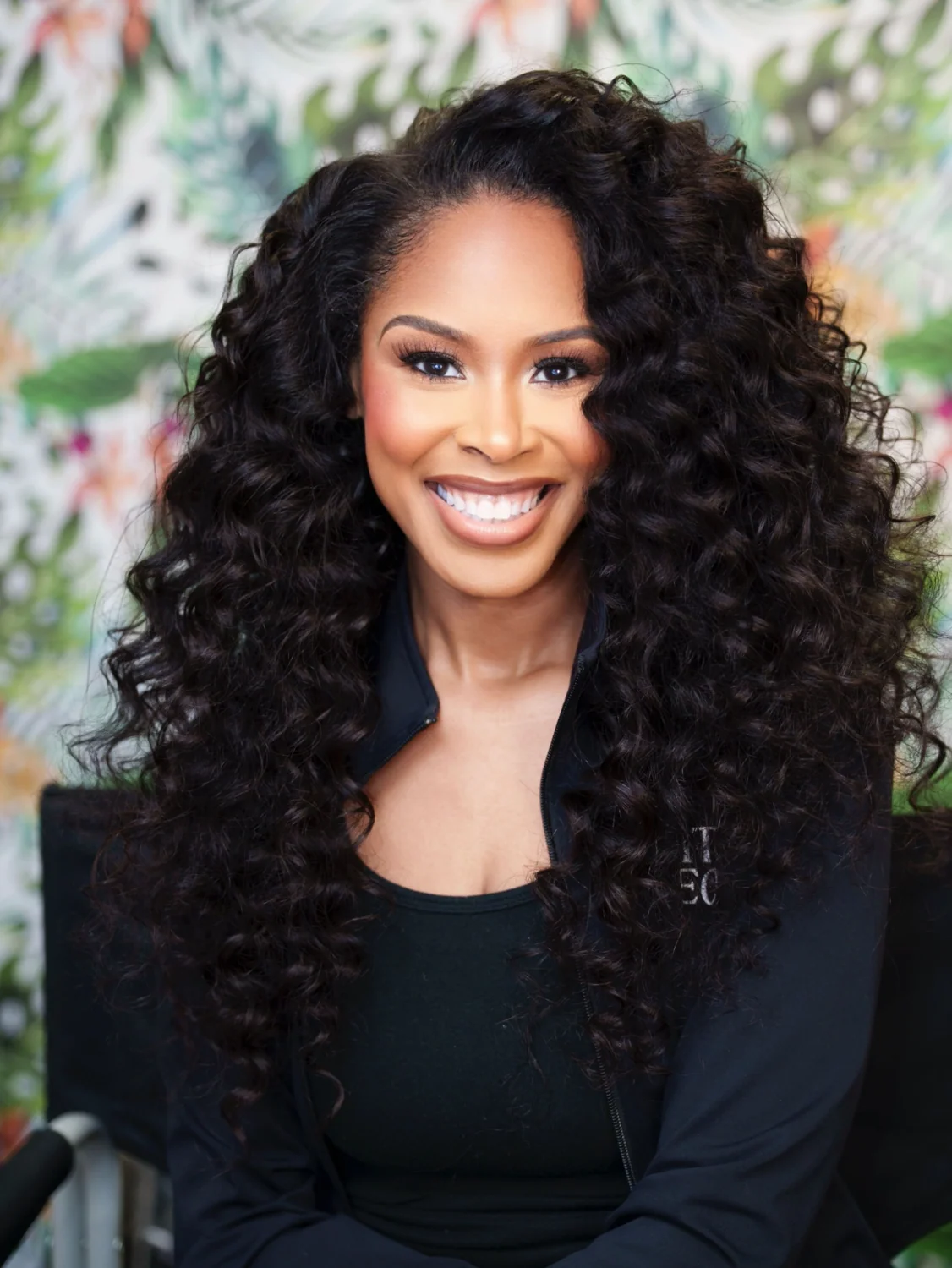 Winter Henderson smiling in a professional portrait